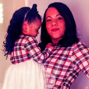 Mother and daughter in matching plaid dresses