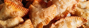 Golden fried empanadas with crimped edges